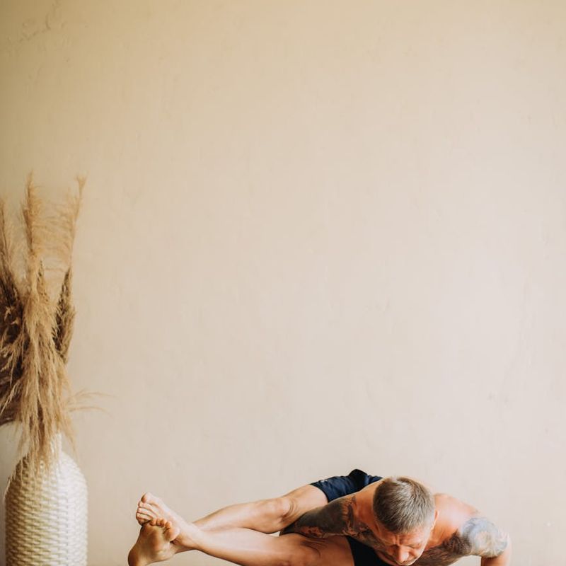 Person in a focused balancing yoga pose.